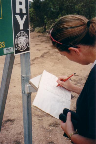 Kirsty signing the book.  This page has records of visits from '97 and earlier.  Somehow, this remote, desolate area is not on m