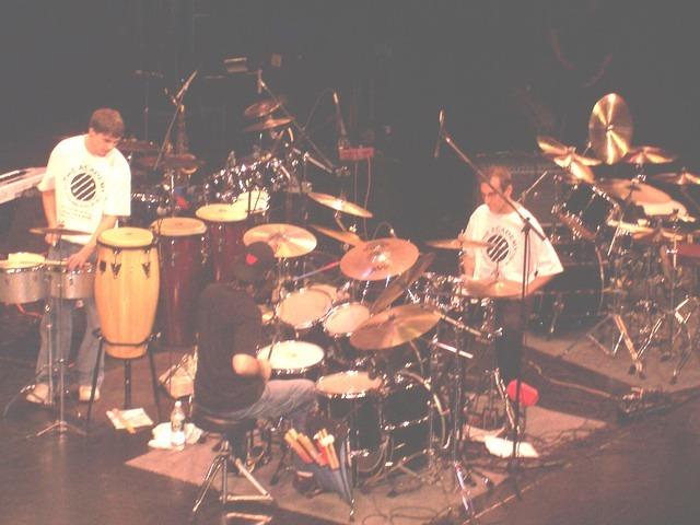 The Academy of Drums instructors in a drum trio.