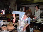 2004 0128KarenFrostingHerPeanutButterCake